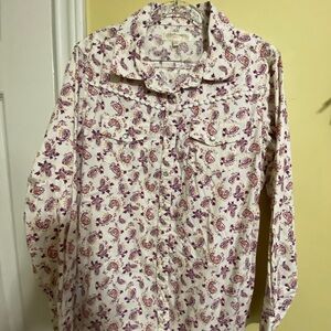 Young girl western shirt with snap buttons and two pockets.